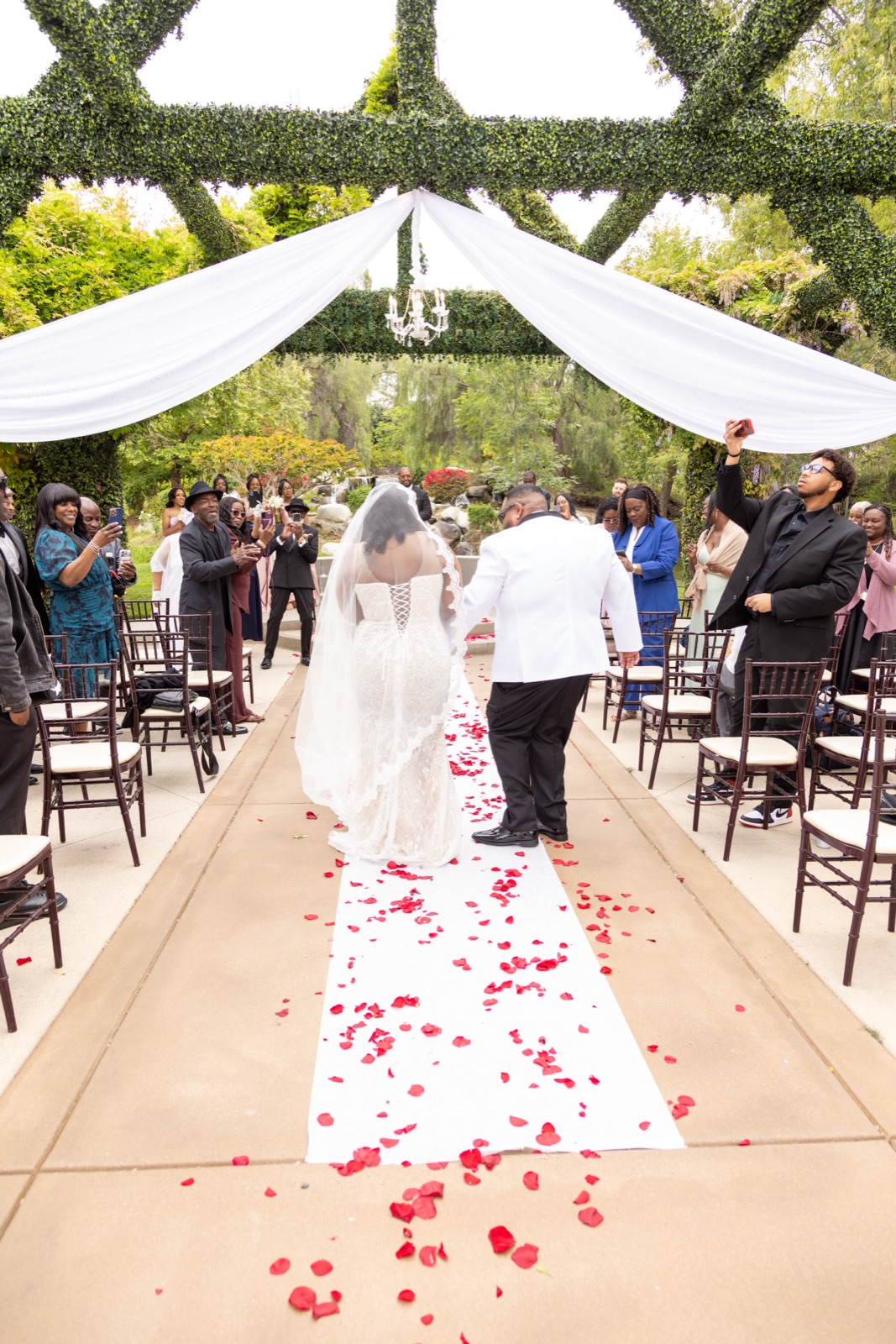 Wedding ceremony aisle with rose petals, photographed by CAM Studios LA