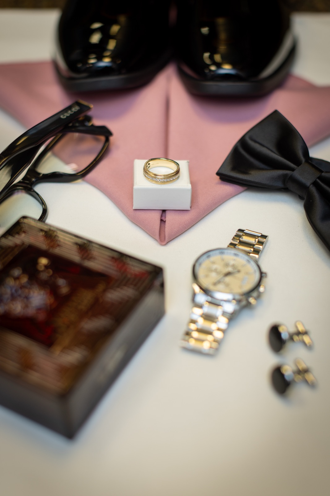 Groom's details: watch, cufflinks and bow tie
